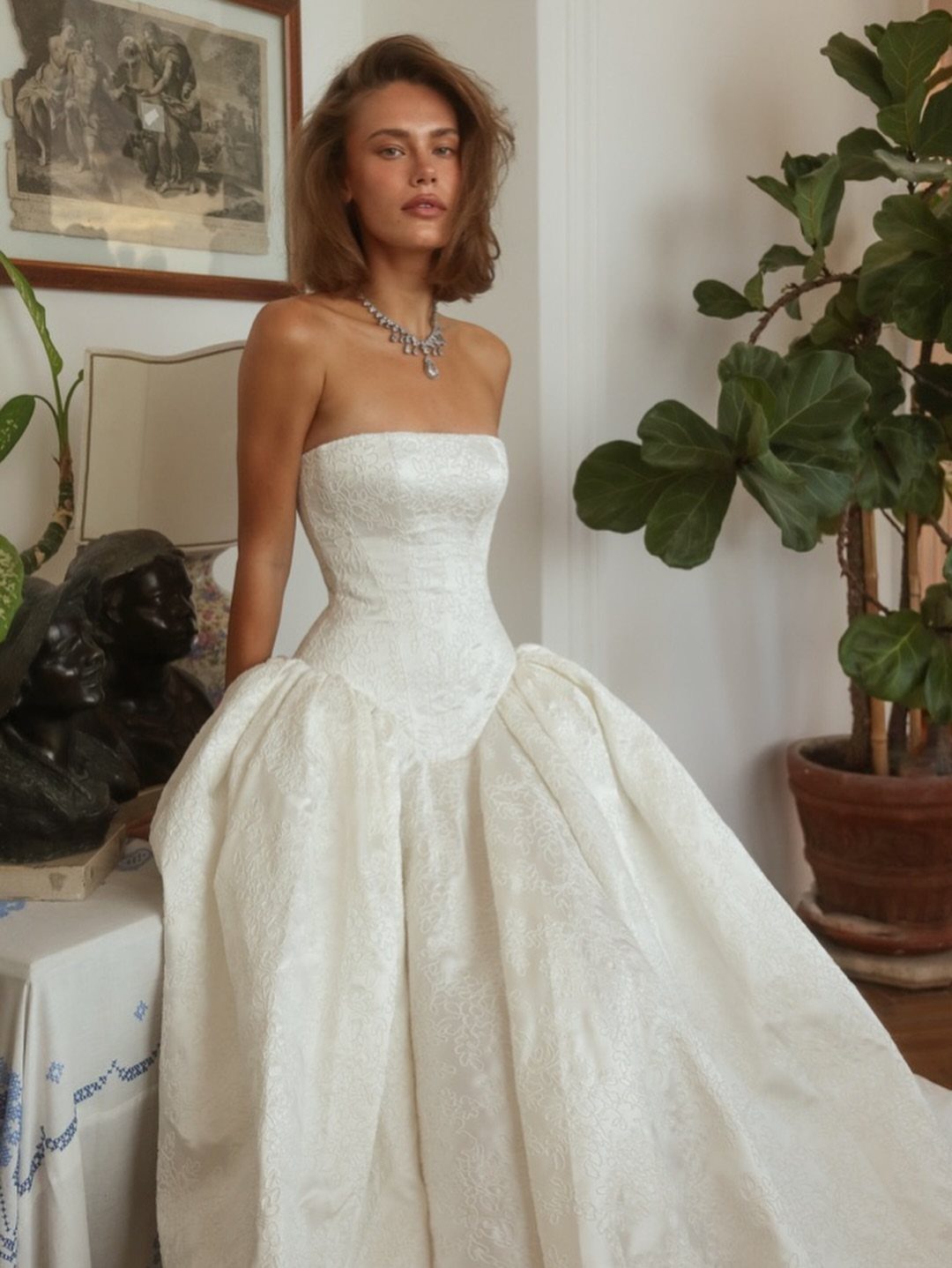 6 Basque Wedding Dress Ideas, from Lace to Ball Gowns 6 Woman in a white strapless wedding dress with a pointed basque waistline.