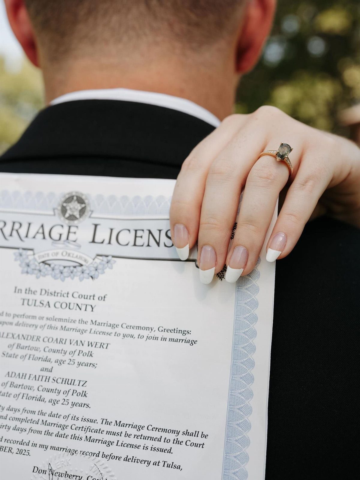 City Hall Wedding Ideas: 7 Ways to Plan the Day 1 Marriage license held against a man in a suit with a ringed hand resting on it