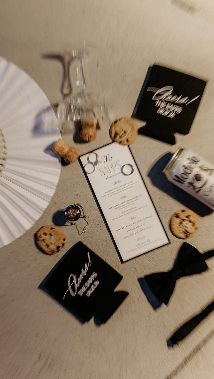 Colour Scheme for Wedding: 15 Ideas and Palettes 11 Wedding flat lay with black and white accessories, cookies, and a striped fan.