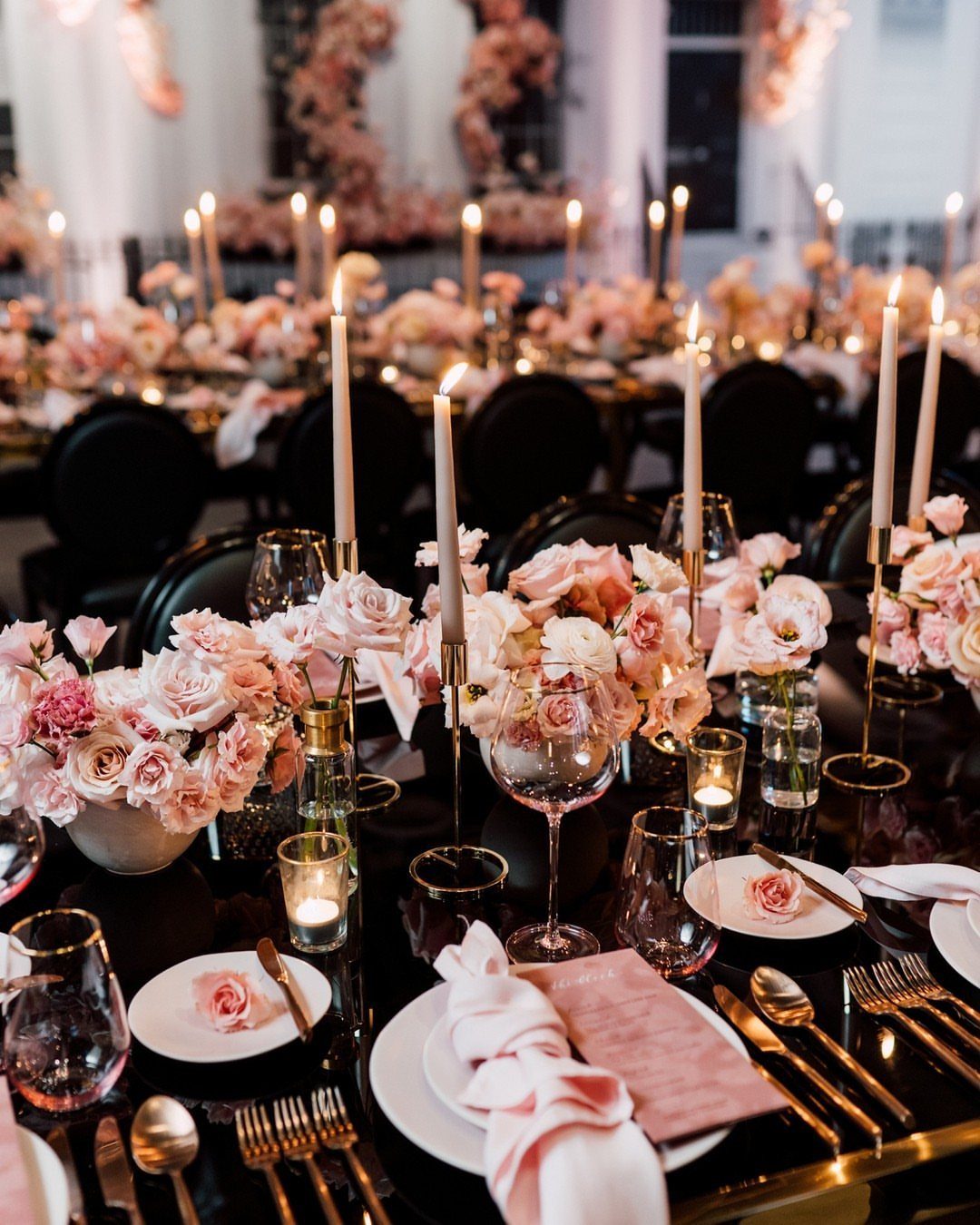 Colour Scheme for Wedding: 15 Ideas and Palettes 10 Wedding table setting with pink roses, gold cutlery, and white candles on black surface.