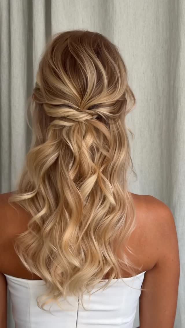 14 Ideas for Hair for a Wedding Guest, From Buns to Waves 3 Blonde wavy hair styled in a half-up, half-down twist for a formal occasion.
