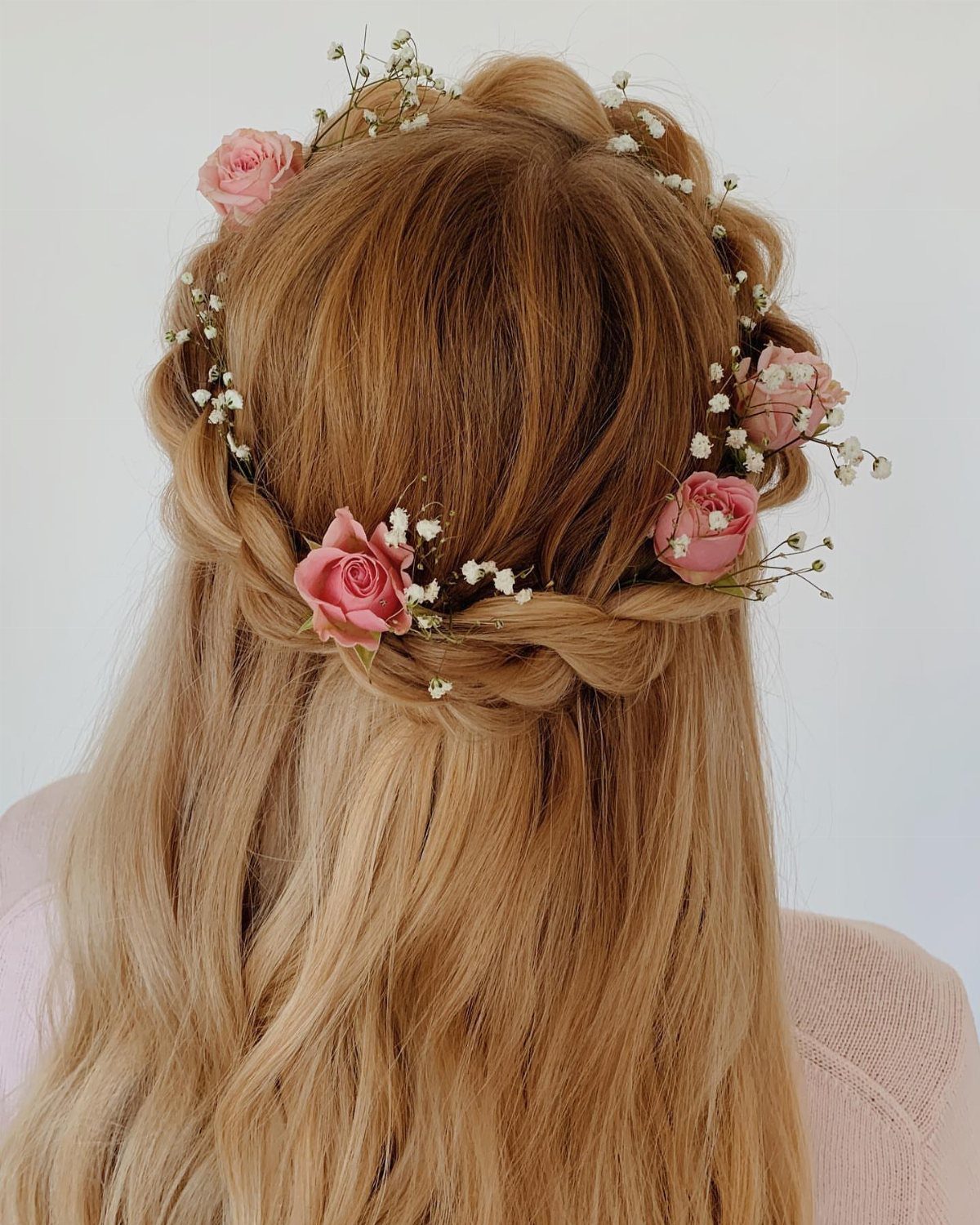 11 Half Up and Down Wedding Hair Ideas for Brides 7 Blonde hair in a braided half-up style with a pink rose floral crown.
