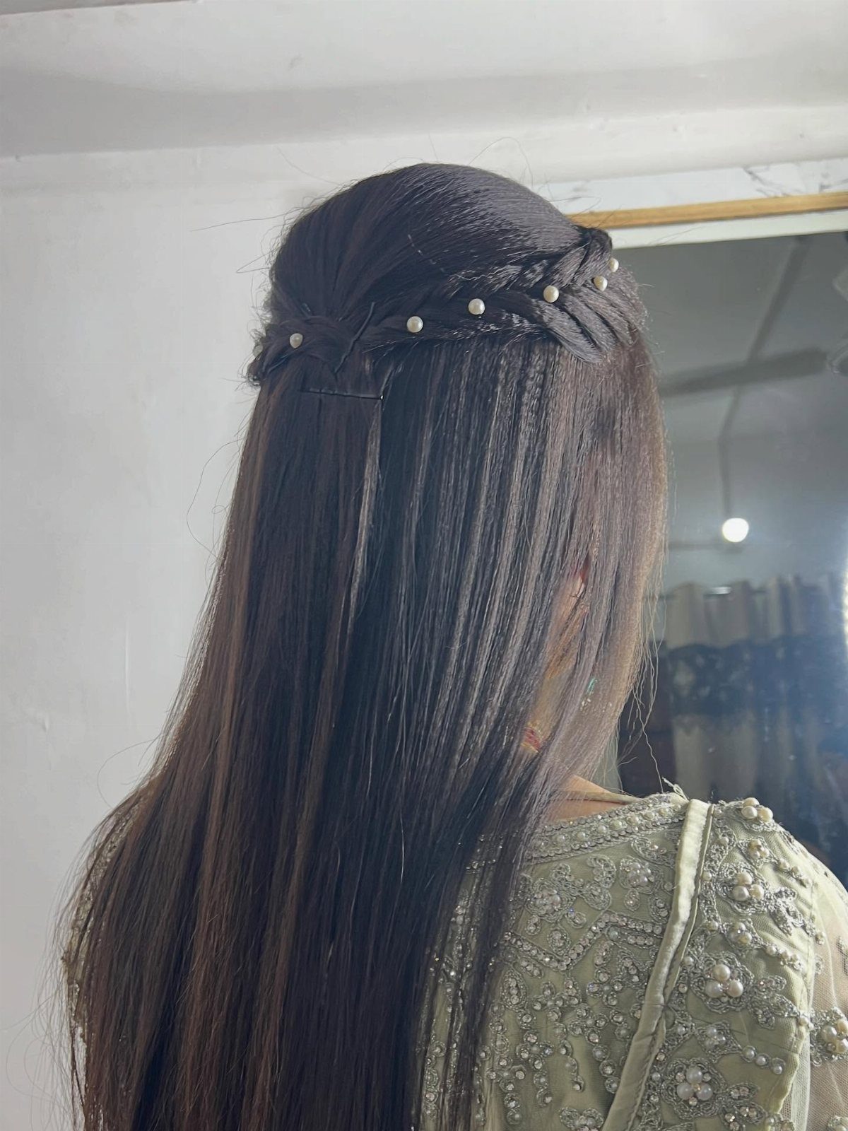 15 Long Hair Wedding Styles for Braids, Buns and Waves 13 Long dark brown hair styled with a braided crown and small white pearls