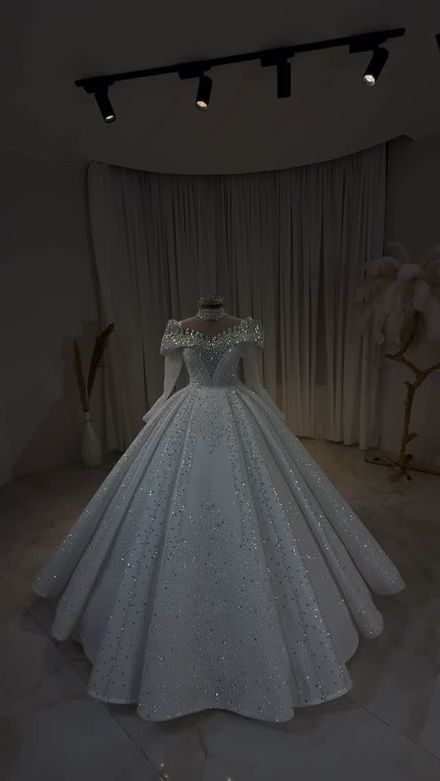 Sparkling white princess style wedding dress with a full ballgown skirt on a mannequin