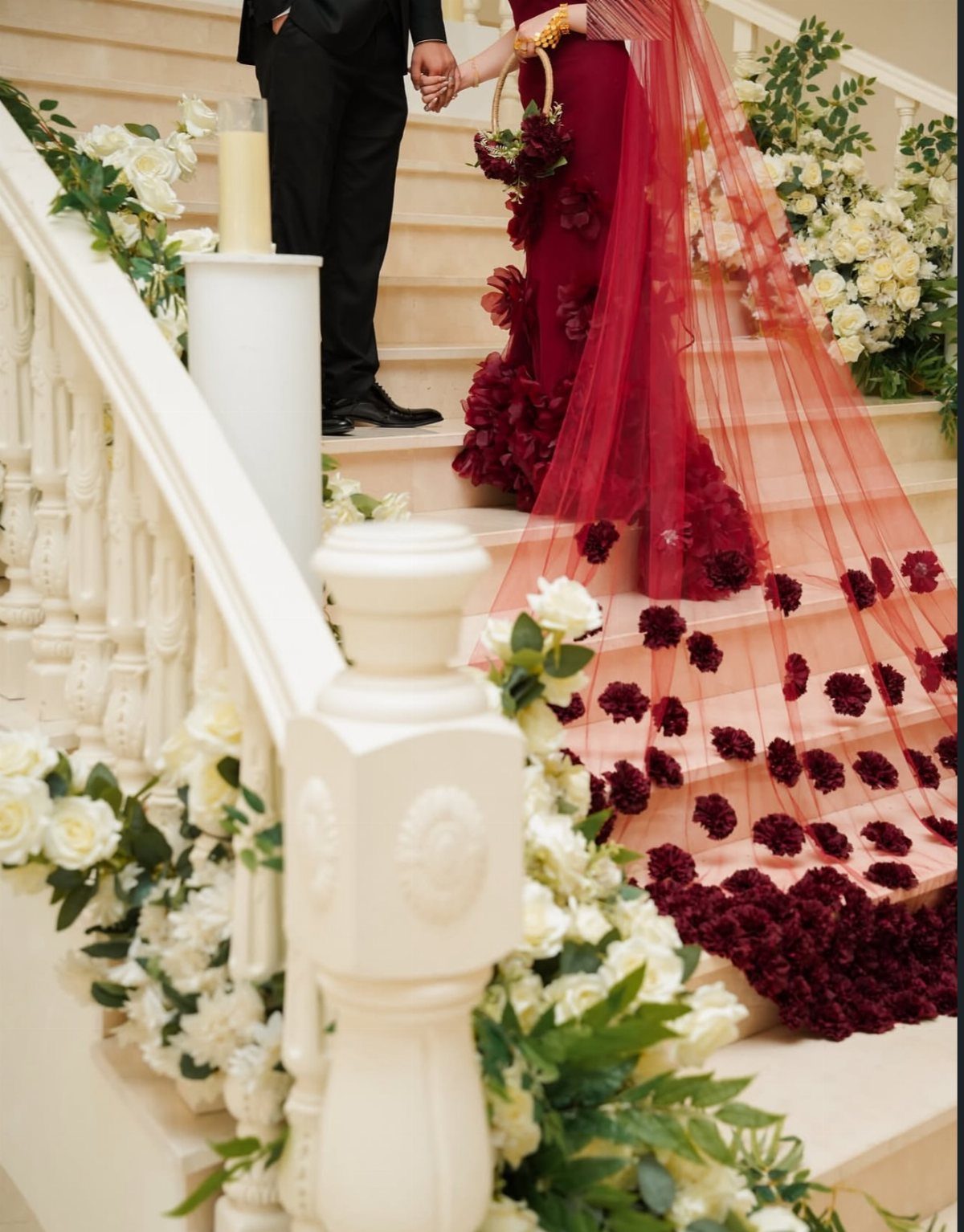 10 Red Wedding Dresses for Brides Who Want Color 4 Deep burgundy red wedding gown with floral details and a long matching veil.