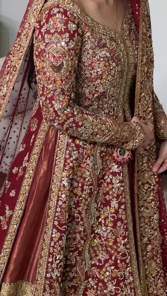 10 Red Wedding Dresses for Brides Who Want Color 2 Red and gold traditional bridal gown with intricate embroidery and matching red veil.