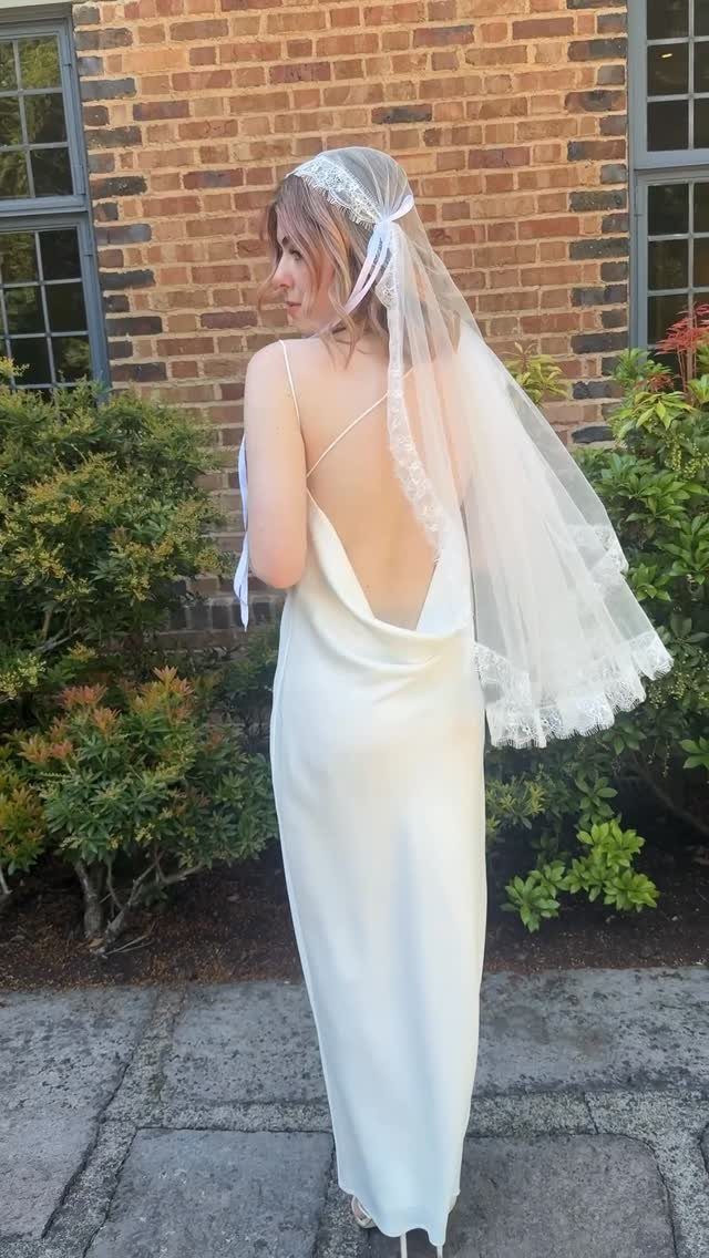 Short Wedding Hair with Veil: 5 Ideas for Brides 4 Woman with short blonde hair wearing a white wedding dress and lace veil.