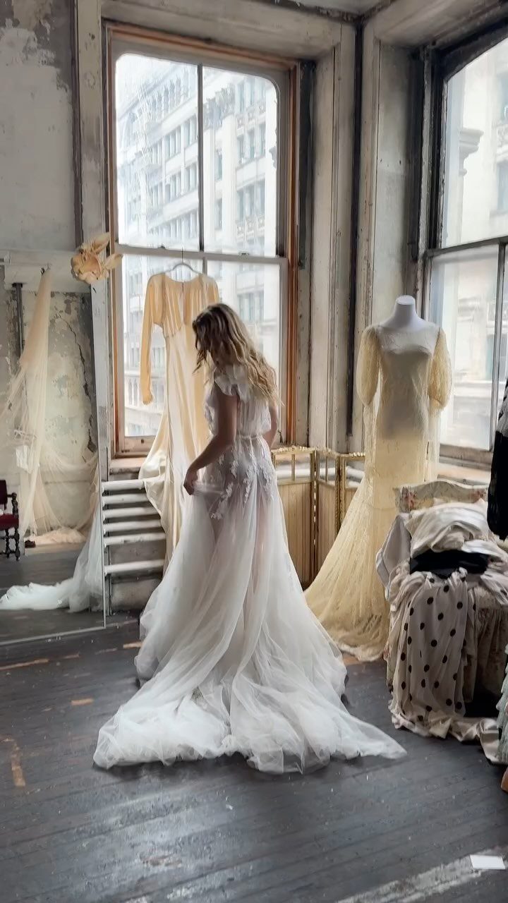 Wedding Dress Options: 8 Silhouettes From A-Line to Vintage 8 Woman in a white lace vintage-inspired wedding dress in a rustic studio setting