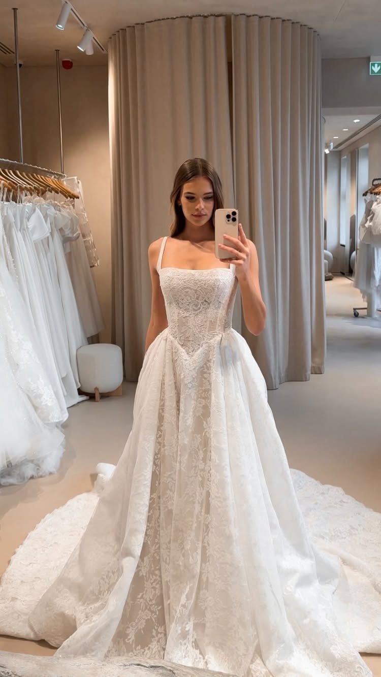 Wedding Dresses Elegant and Classy: 14 Gown Styles 1 Woman in a white lace wedding dress with a full princess silhouette skirt.