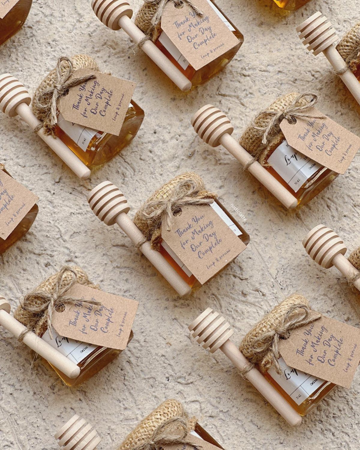 30 Wedding Guest Keepsakes Your Guests Will Actually Use 20 Mini honey jars with burlap lids, wooden dippers, and personalized thank you tags.