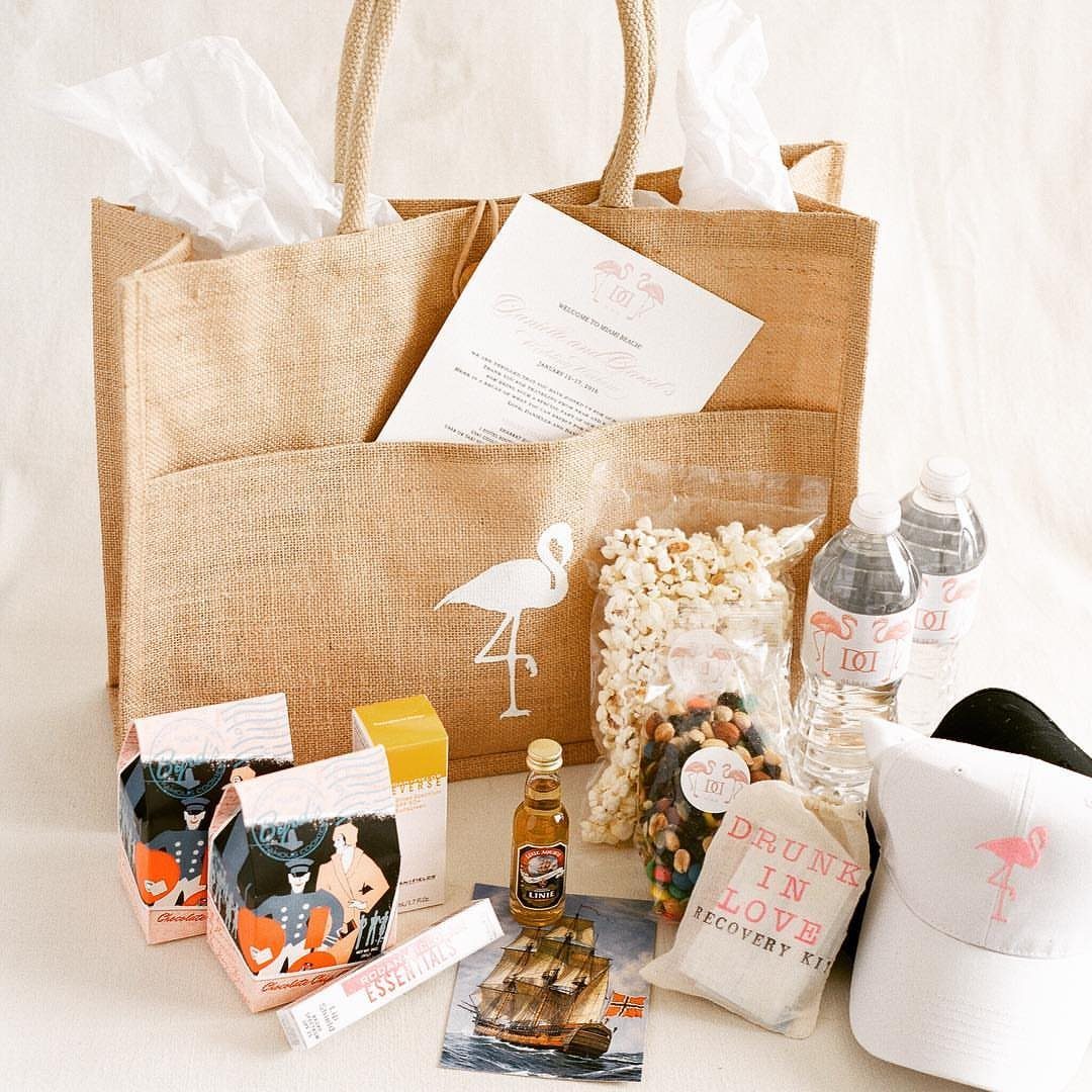 30 Wedding Guest Keepsakes Your Guests Will Actually Use 27 Burlap tote bag and wedding welcome kit including snacks, water, and recovery pouch.