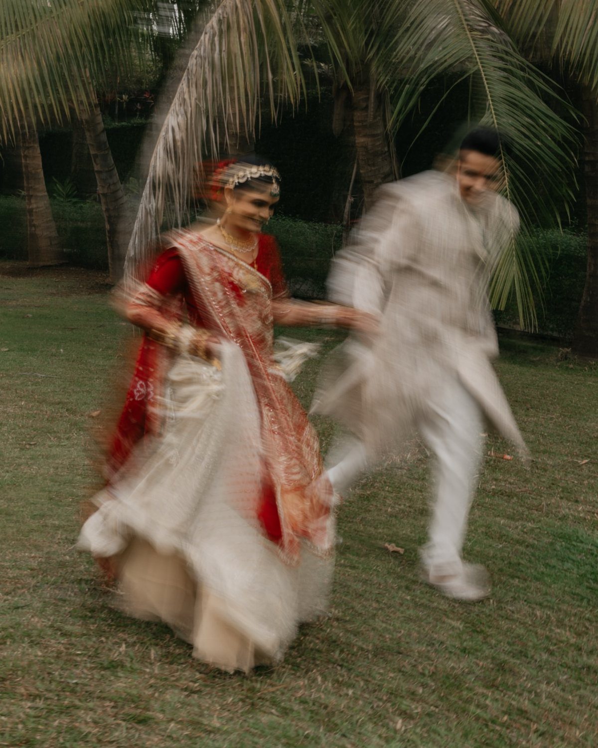 17 Wedding Ideas Pictures to Show Your Photographer 7 Couple in traditional Indian wedding attire dancing and spinning on a green lawn