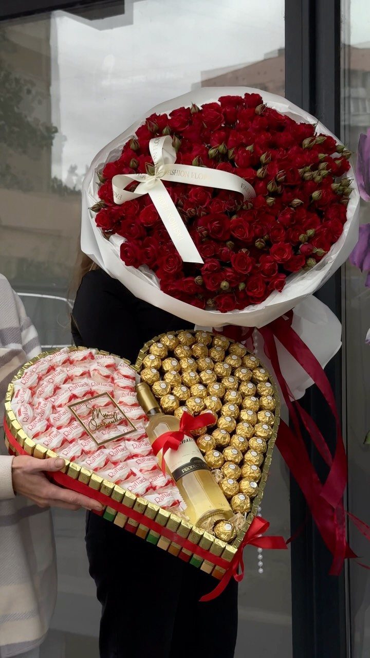 22 Wedding Present Ideas for Couples to Treasure 18 Large red rose bouquet and heart-shaped chocolate and champagne gift tray.
