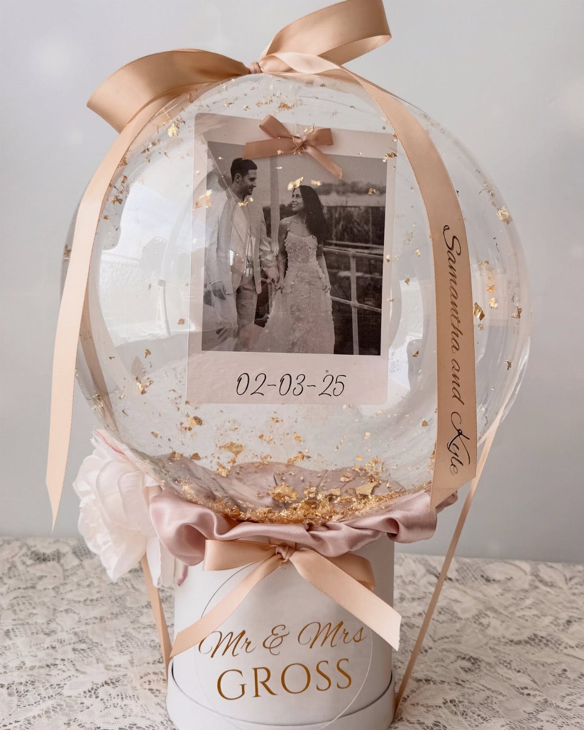 22 Wedding Present Ideas for Couples to Treasure 12 Personalized wedding gift balloon with a couple's photo and a custom gift box.