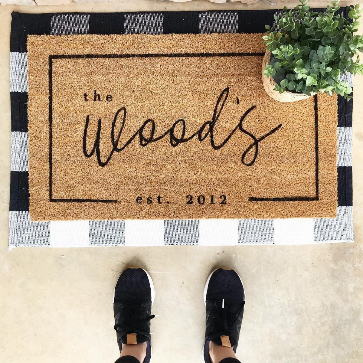 22 Wedding Present Ideas for Couples to Treasure 9 Personalized brown coir doormat with the family name and established date on a rug.