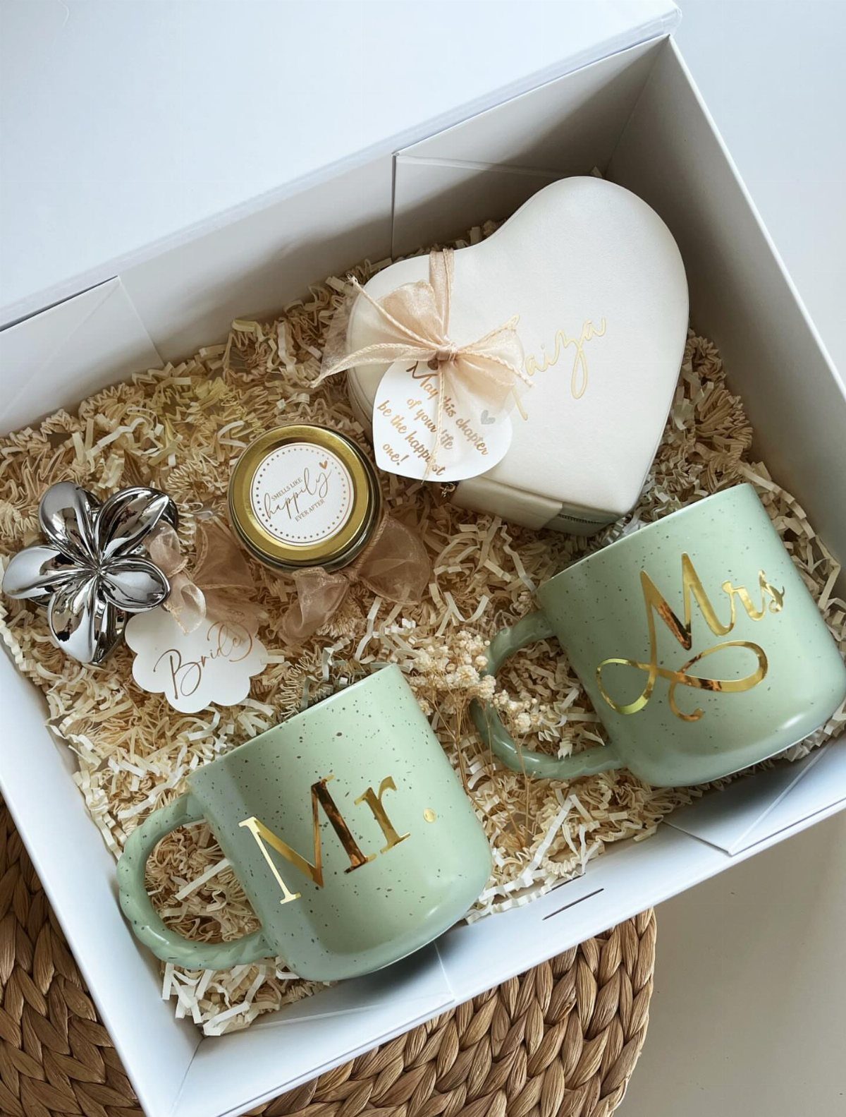 22 Wedding Present Ideas for Couples to Treasure 20 Wedding gift box with Mr. and Mrs. mugs, heart candle, and silver ornament.