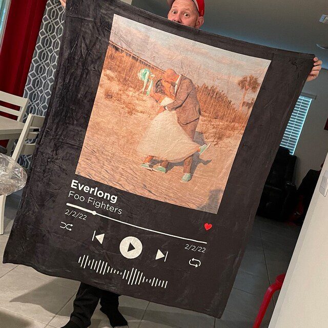 22 Wedding Present Ideas for Couples to Treasure 6 Black personalized blanket featuring a couple's photo and a music player design.