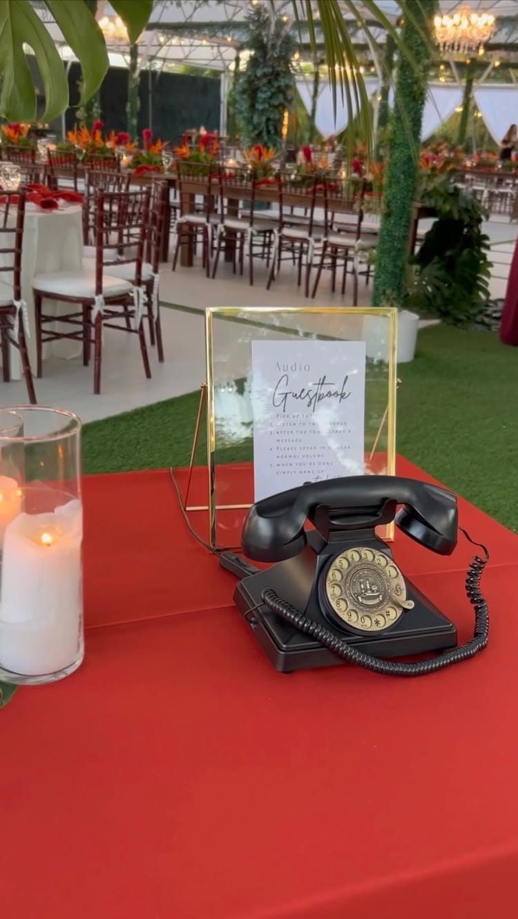 13 Wedding Reception Ideas for Guests Who Love Fun 4 Vintage black rotary telephone and audio guestbook sign on a red wedding table.
