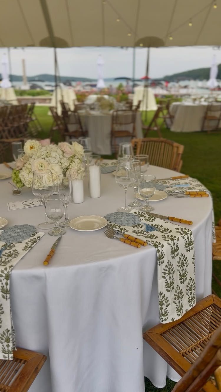 17 Wedding Reception Venues for Every Style and Budget 17 Round wedding reception table with white linens and flowers under a white event tent.