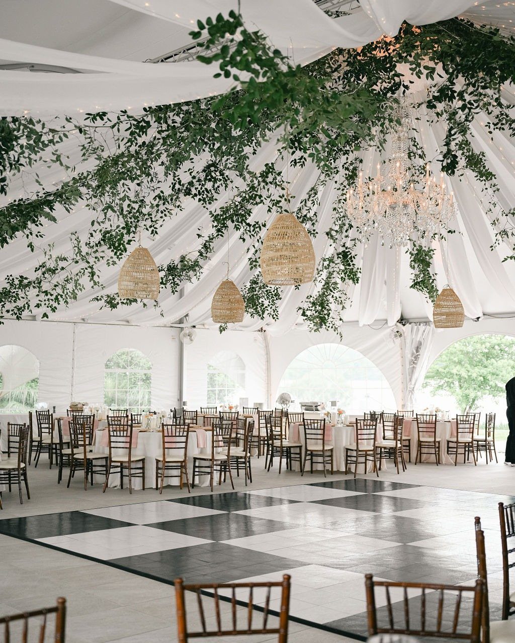 Wedding Venues Western Couples Love: 16 Ideas 4 Wedding reception in a white tent with checkered dance floor and hanging greenery